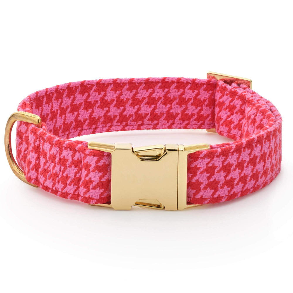 Pink and red houndstooth dog collar without its bow, showing the gold buckle, D-ring, and adjustable strap.