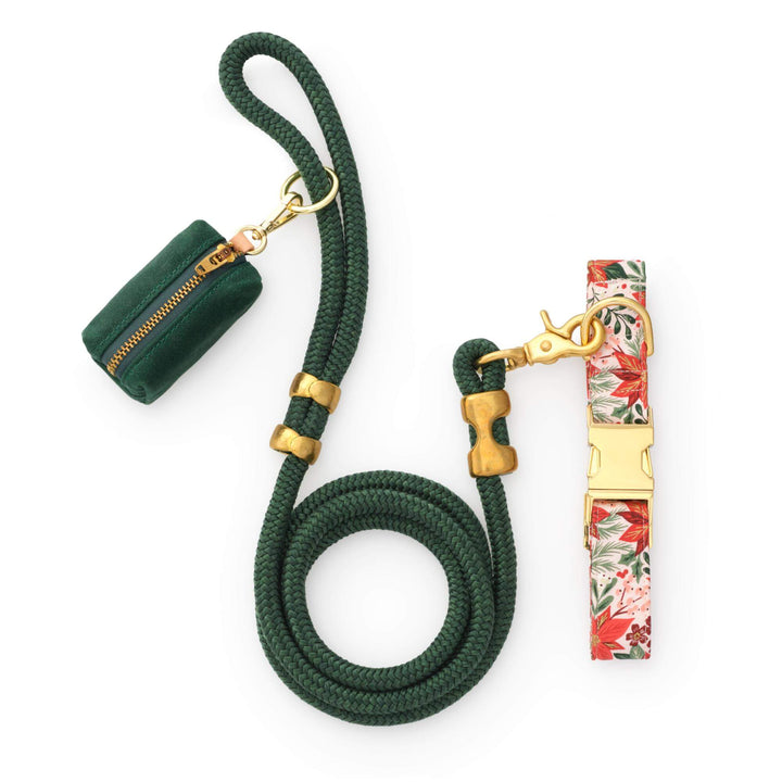 Evergreen rope leash with poinsettia print collar and green waxed canvas bag holder on white
