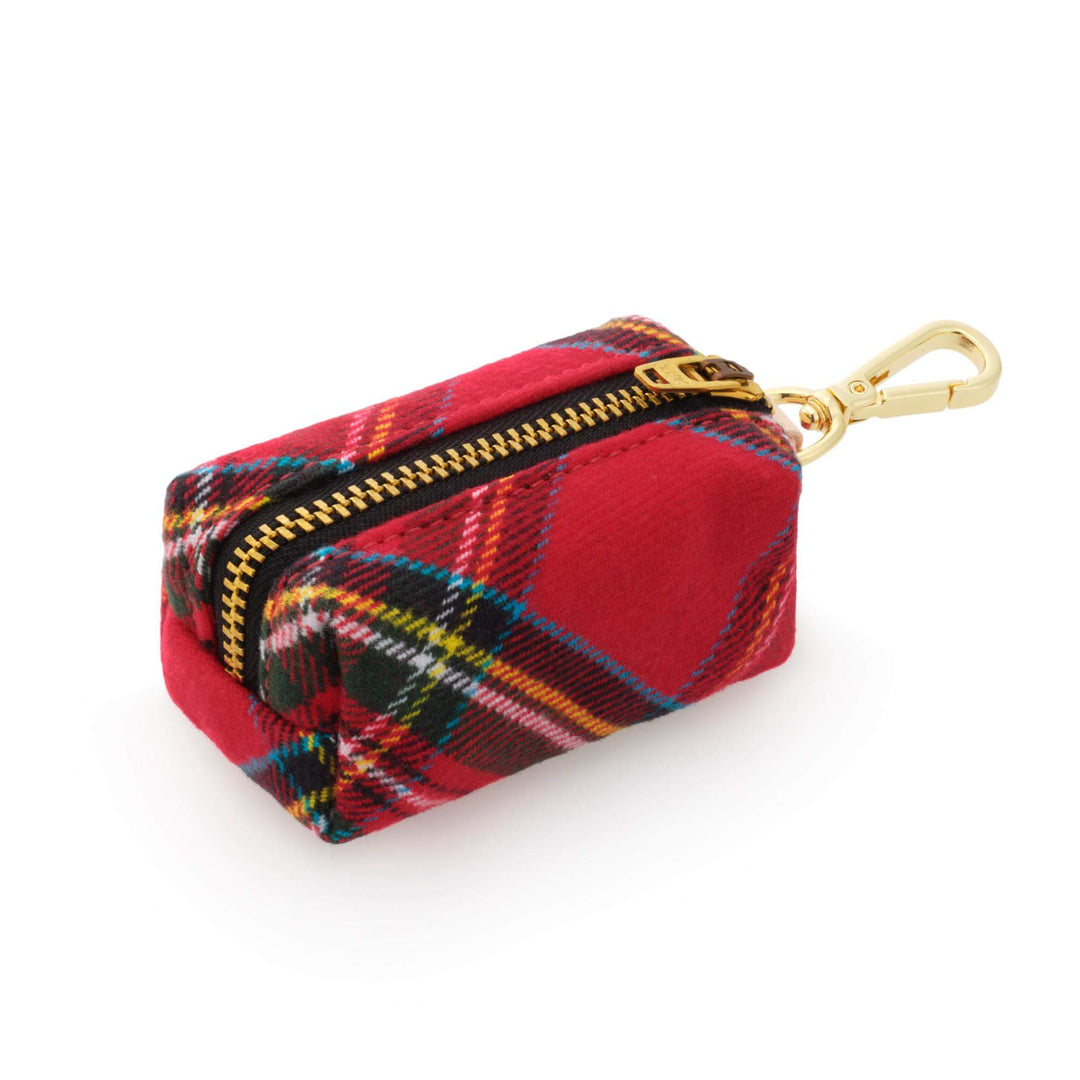 Angled side view of a red tartan dog waste bag holder showing the zipper and compact box shape.