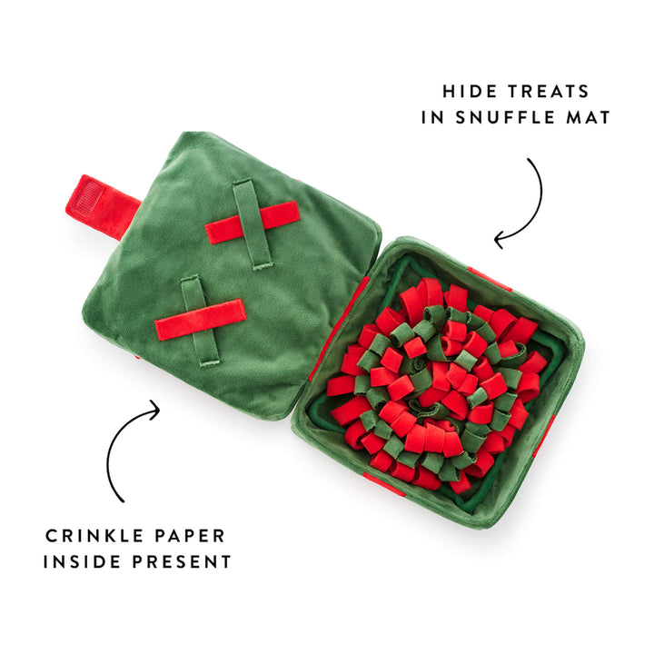 Present toy open to its red and green snuffle mat, crinkle panel labeled