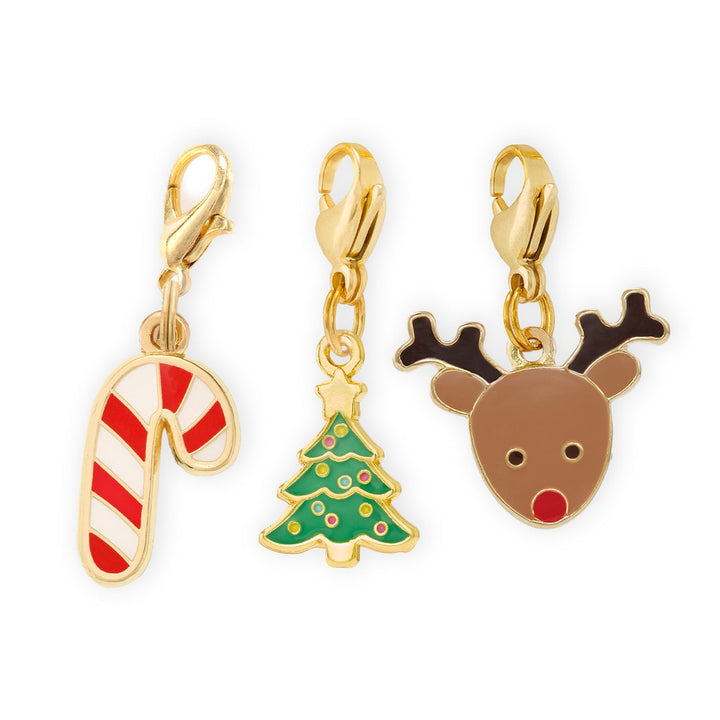 Gold-edged candy cane, Christmas tree, and red-nosed reindeer collar charms with gold clasps on white.