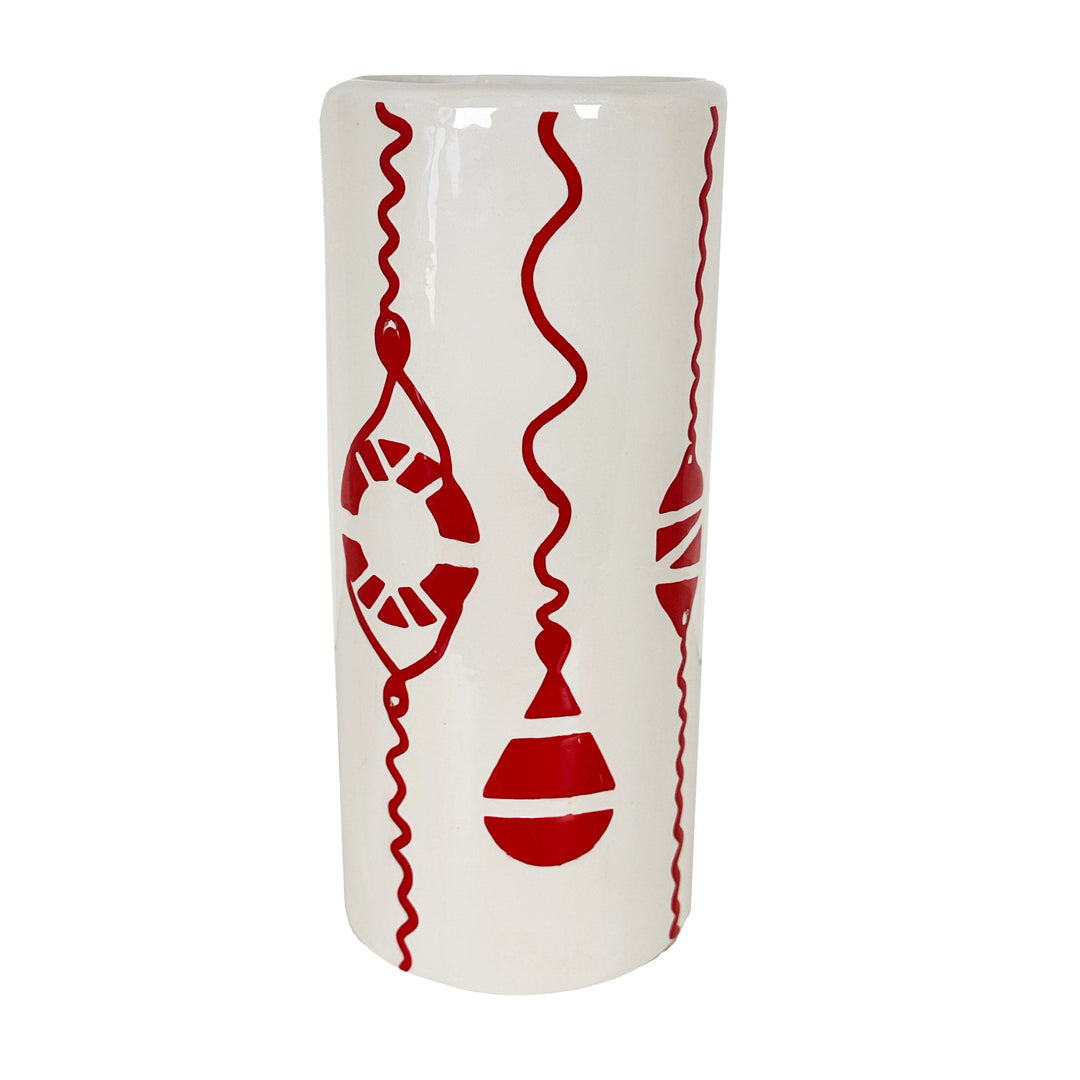White vase with red decorative patterns on a white background