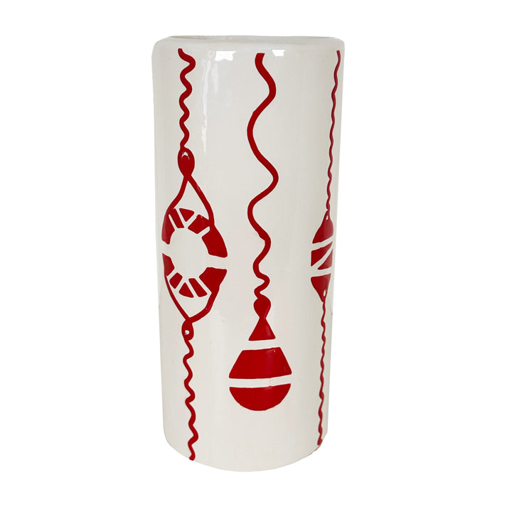 White vase with red decorative patterns on a white background