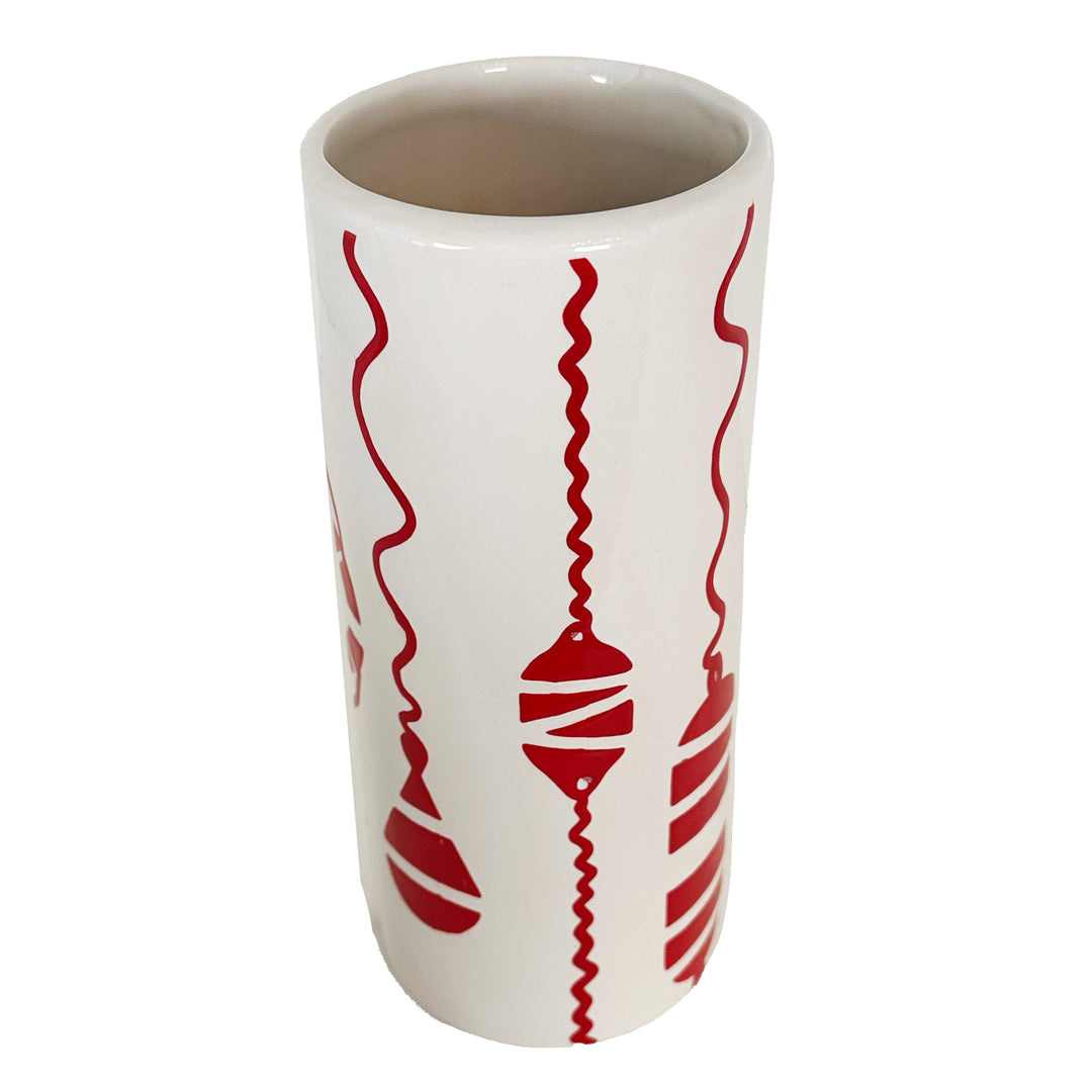 White mug with red decorative patterns on a white background