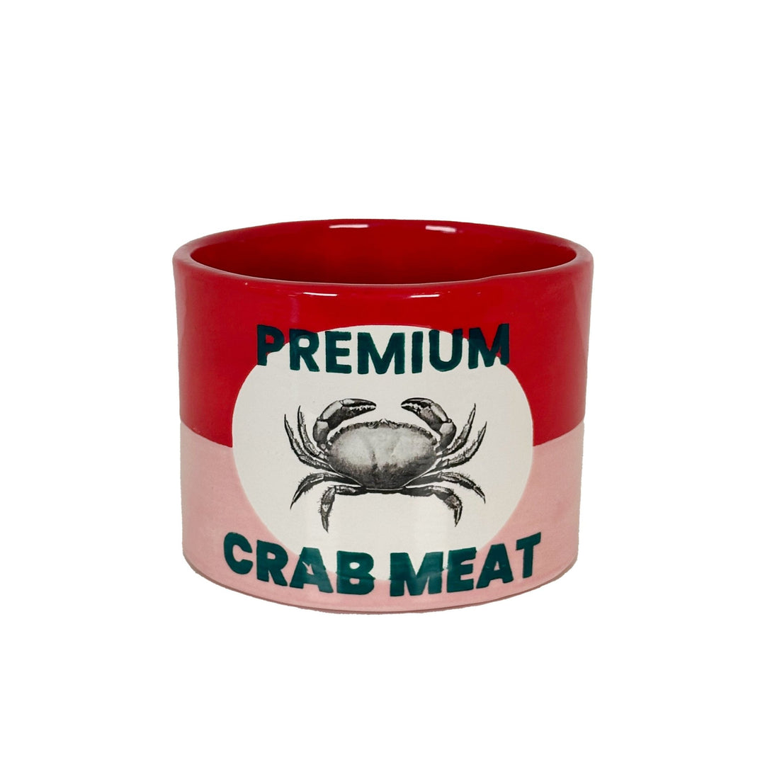Red and pink ceramic vase styled like a vintage crab meat can, with a crab illustration on a white oval label