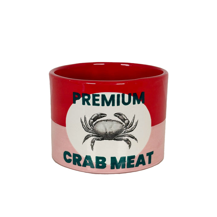 Red and pink ceramic vase styled like a vintage crab meat can, with a crab illustration on a white oval label