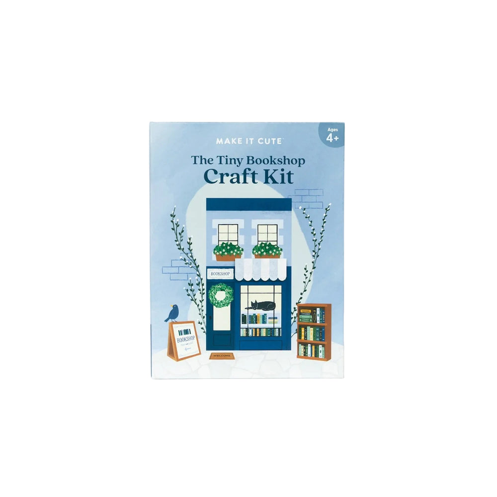 The Tiny Bookshop Craft Kit box in periwinkle blue with a pictured paper bookstore on the cover