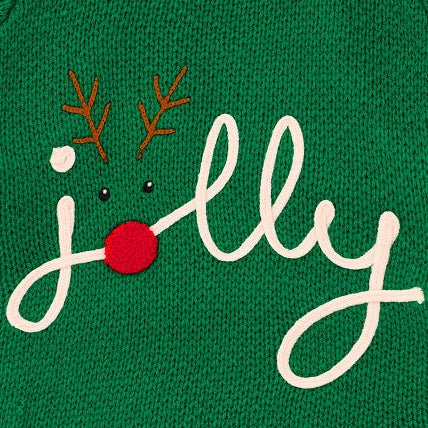 Close-up of cream jolly script with brown reindeer antlers and a round red nose on the green knit dog sweater.