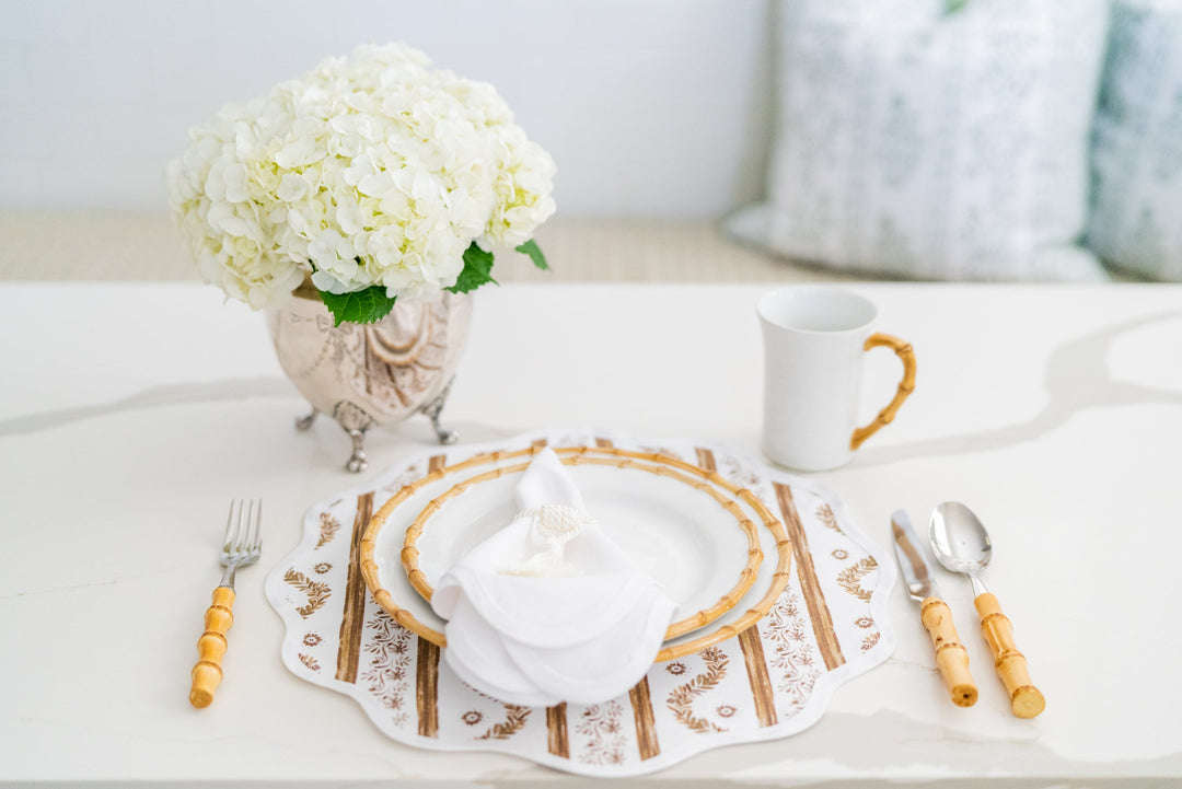 Boxwood Garden espresso round placemat with a scalloped edge