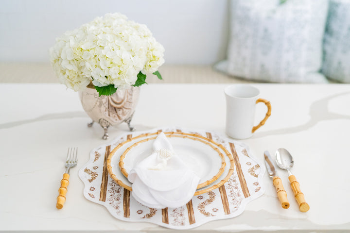 Boxwood Garden espresso round placemat with a scalloped edge
