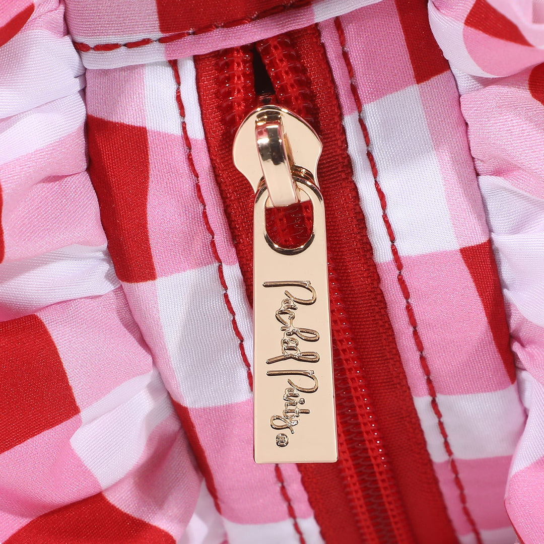 Red and white gingham clutch with a ruffled edge and poly lining
