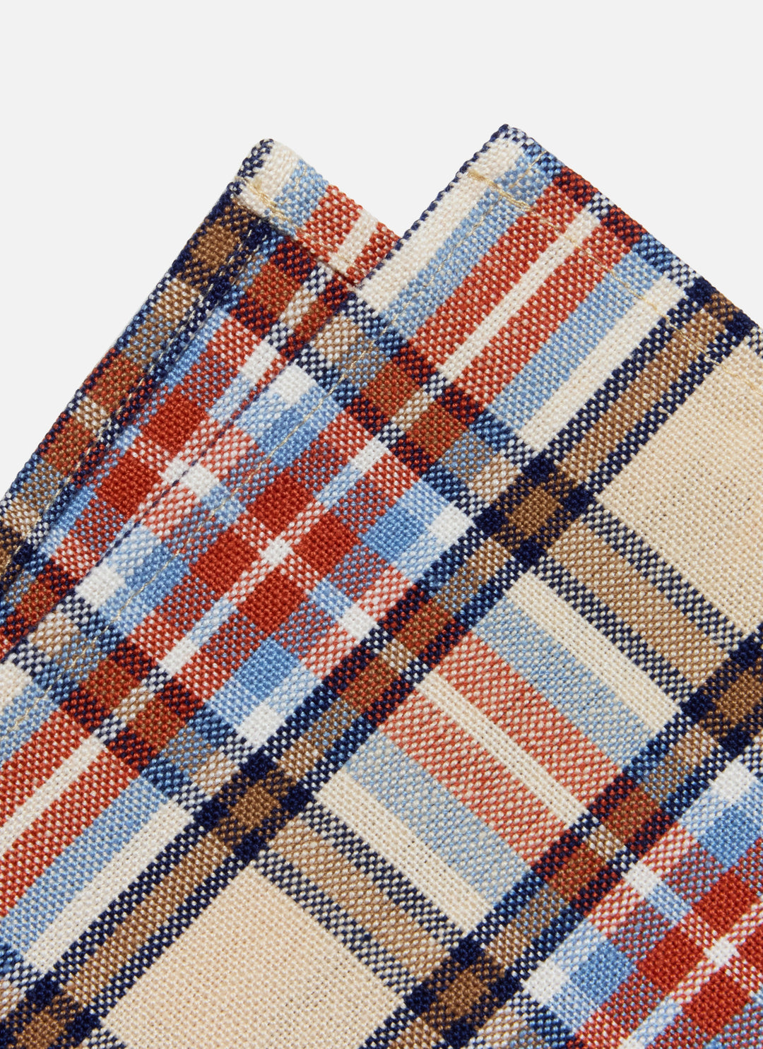 Close-up of the Laurel plaid weave showing red, navy, and pale blue lines on a cream ground