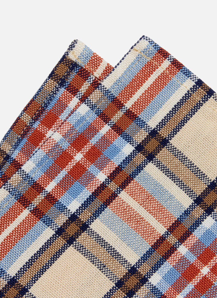 Close-up of the Laurel plaid weave showing red, navy, and pale blue lines on a cream ground