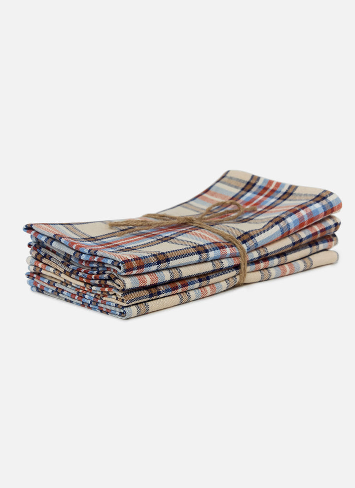 Stack of four Laurel plaid cloth napkins in handwoven cream, red, and blue cotton