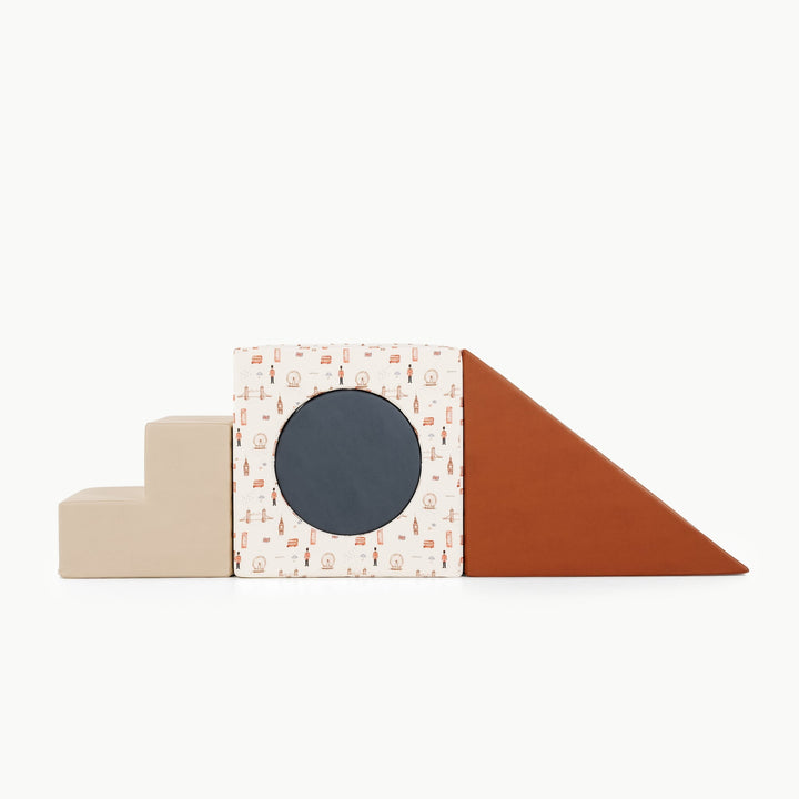 Gathre block playset with foam steps, a cube, and a triangle ramp in cream London print and rust