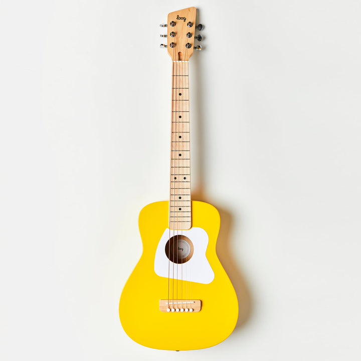 Yellow guitar with a white pickguard on a light gray background