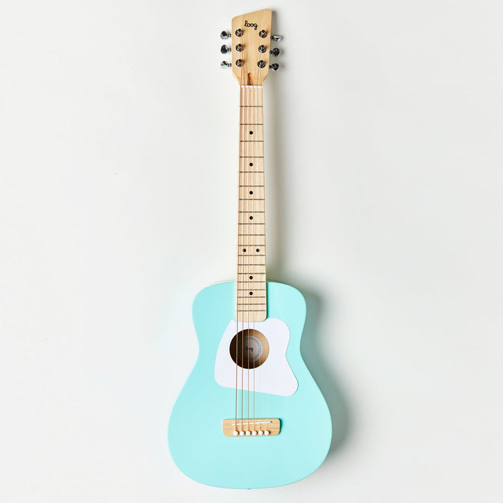 Light blue guitar with wooden neck on a white background