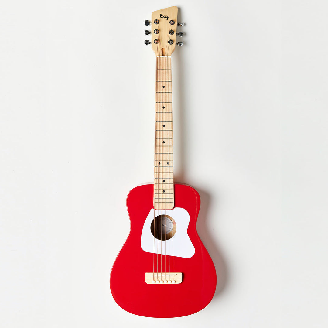 Red guitar with a white pickguard on a light gray background