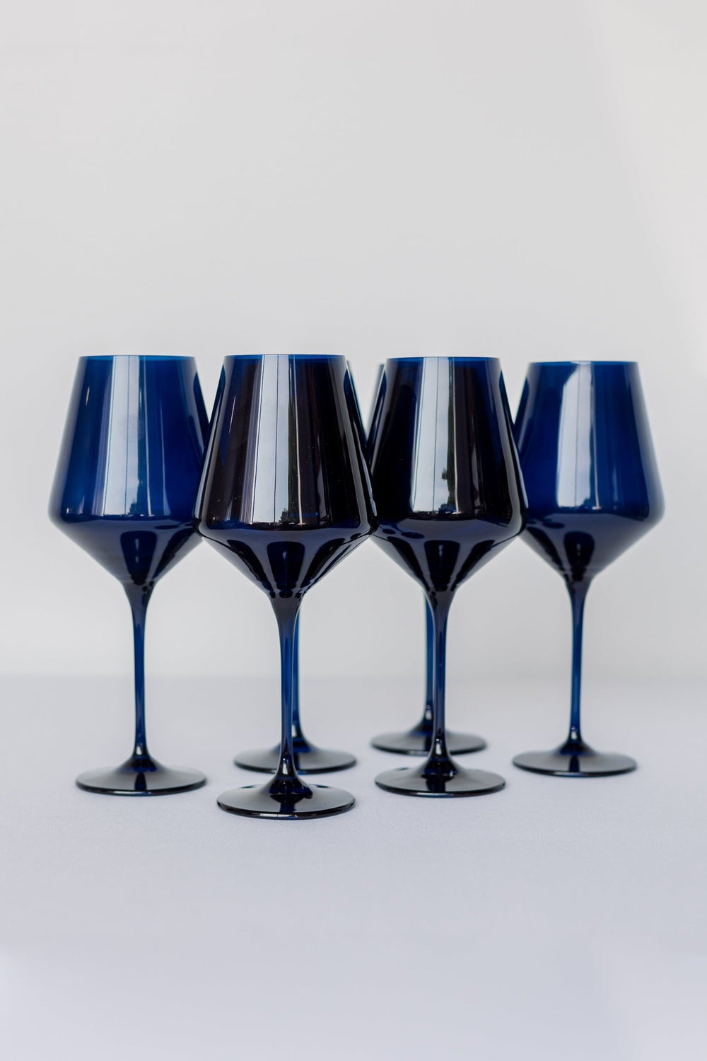 Estelle midnight blue colored glass wine glasses standing together on white, for a celebration table
