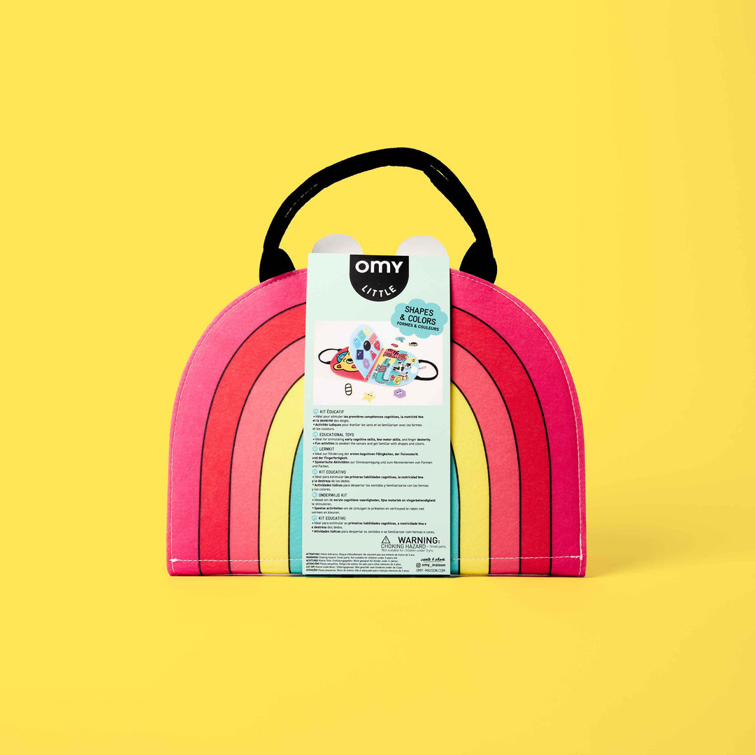 Back of the packaged rainbow Shapes and Colors Montessori kit with product details, on yellow