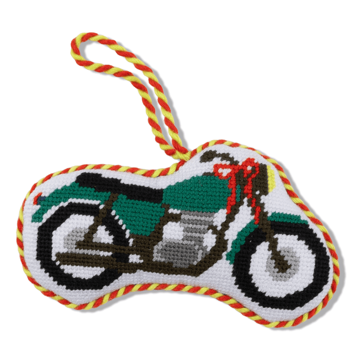 Green vintage motorcycle needlepoint ornament with a red bow and red and yellow twisted cord, front view