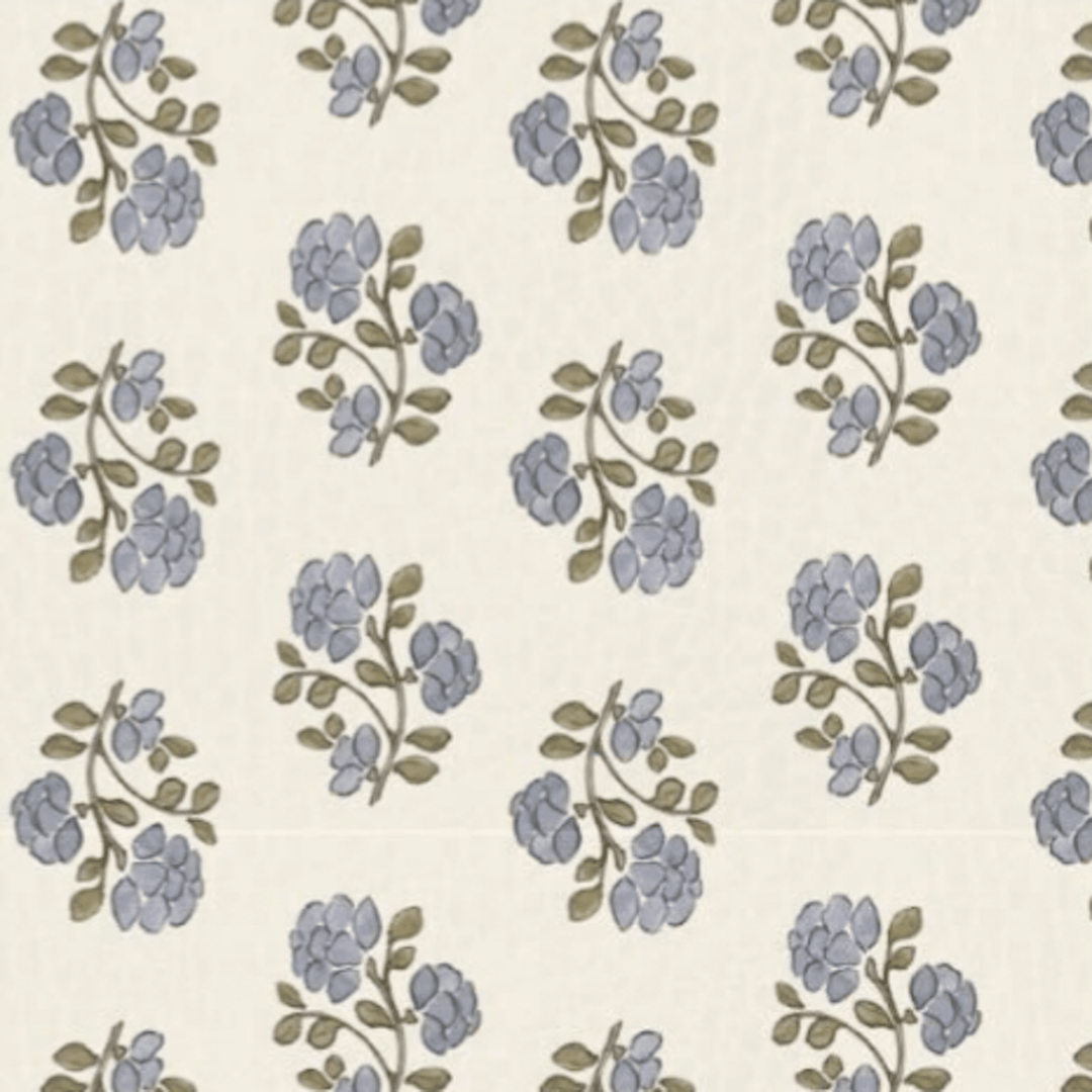 Blue and sage floral block-print pattern swatch on the padded baby play mat.