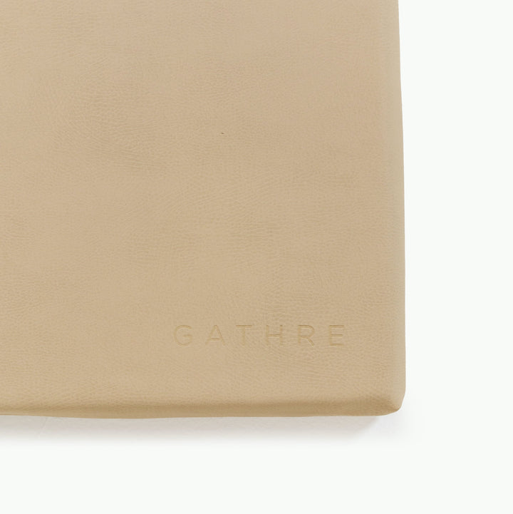 Sand padded play mat, close-up of the wipeable vegan leather corner.