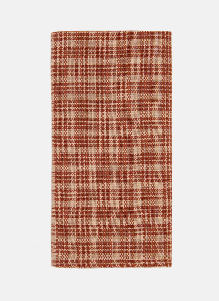 Katherine plaid cloth napkin in oatmeal and burnt sienna, folded to show the handwoven check