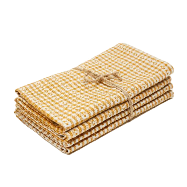 Stack of goldenrod and cream check cotton napkins tied with twine