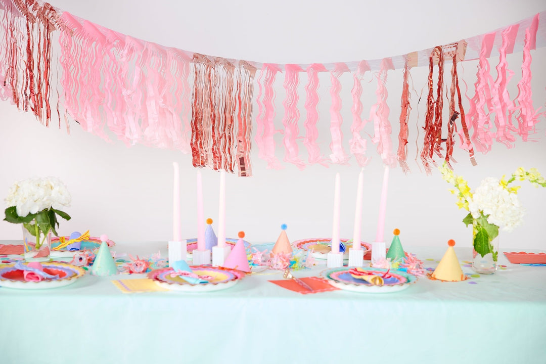 Reusable pink fringe banners for party backdrops and table skirts