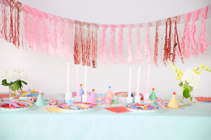 Reusable pink fringe banners for party backdrops and table skirts