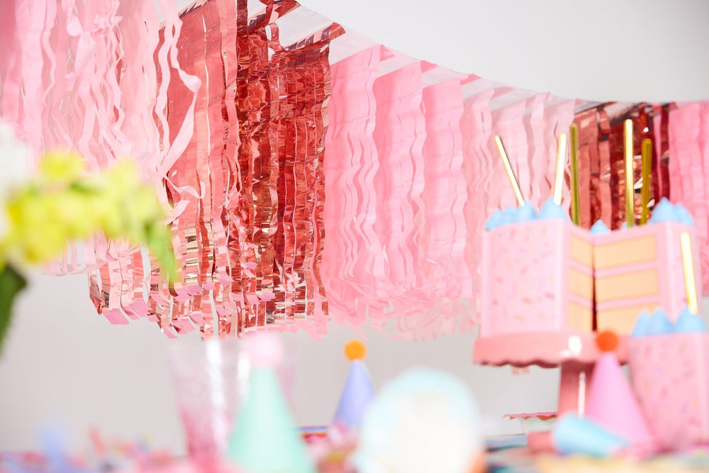 Pink fringe canopy banner with cascading fringe strands for ceilings and doorways