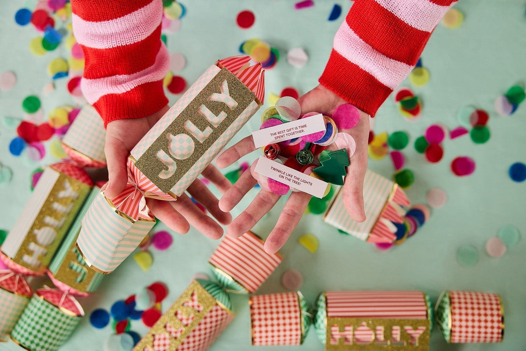 Set of 6 holiday crackers filled with confetti, bells, and cheerful printed sayings