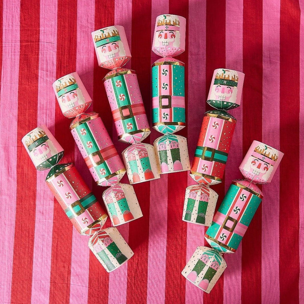 Set of 6 nutcracker holiday crackers filled with confetti, bells, and printed sayings