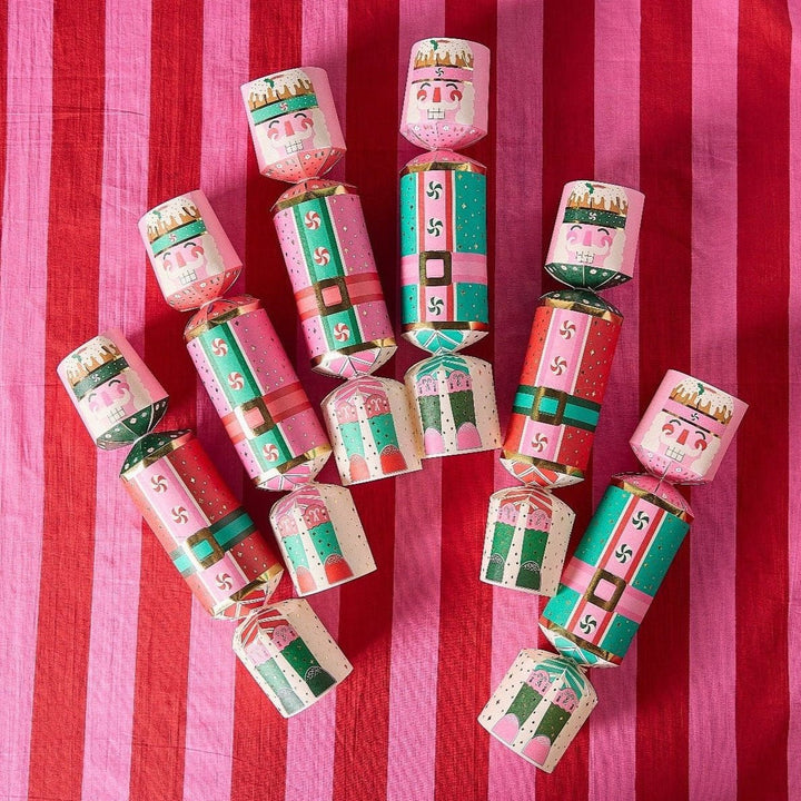 Set of 6 nutcracker holiday crackers filled with confetti, bells, and printed sayings