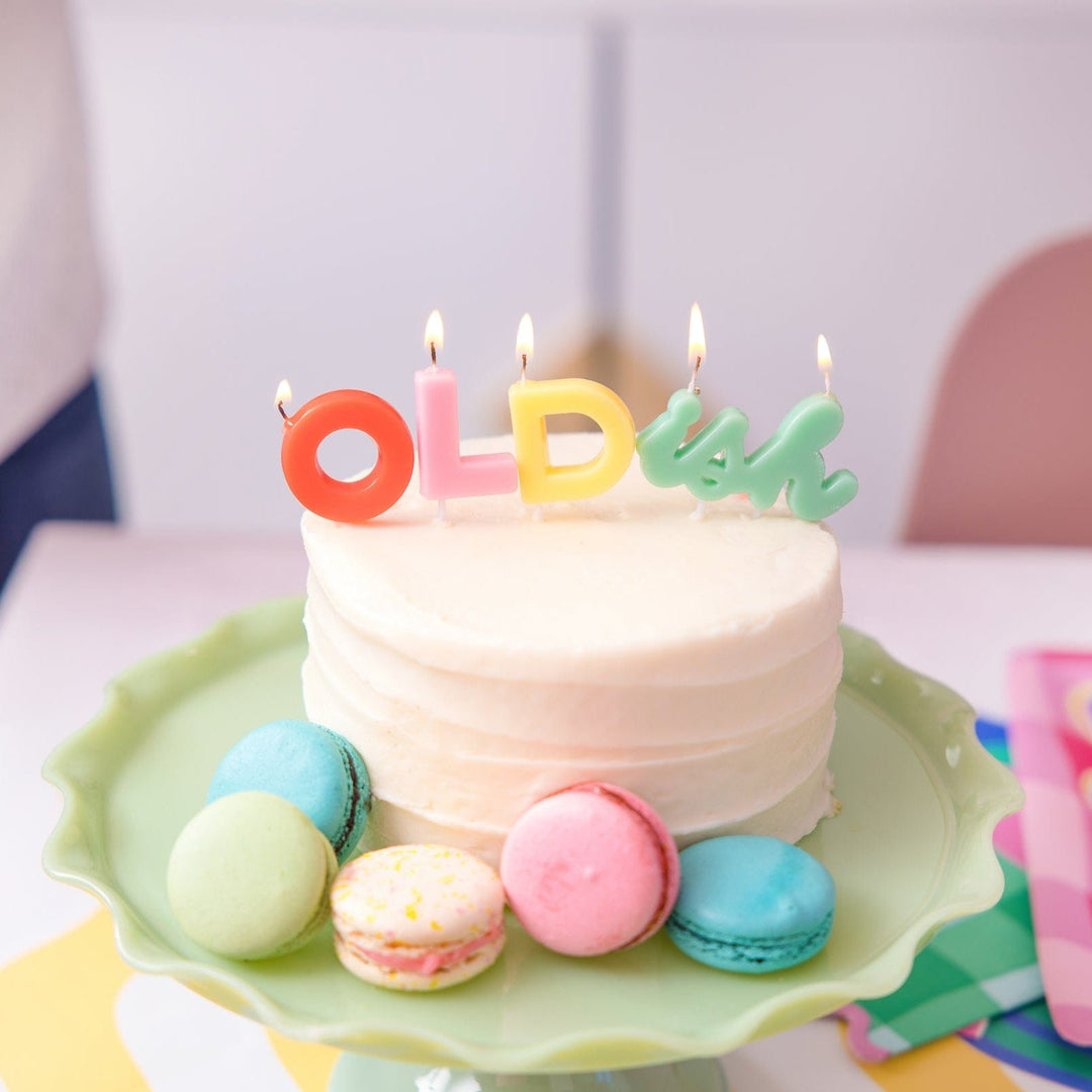 Funny OLDish letter birthday candles, about 6.3 inches across as displayed