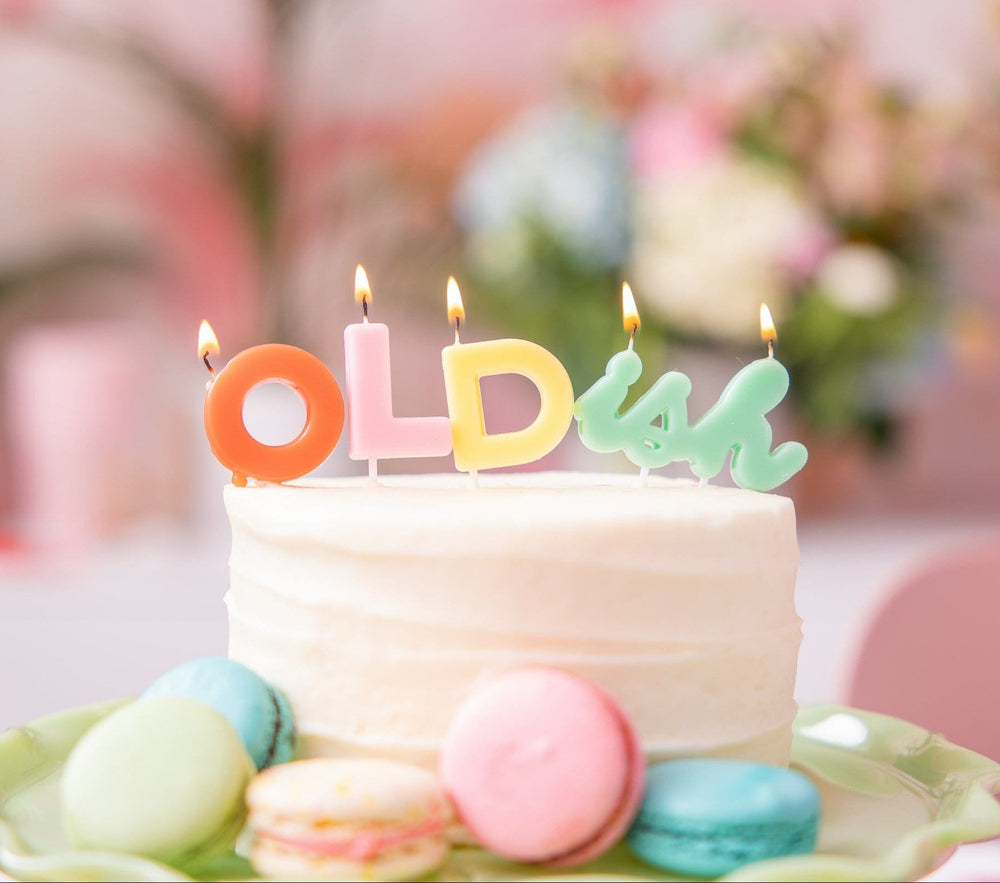 Funny OLDish letter birthday candles, about 6.3 inches across as displayed