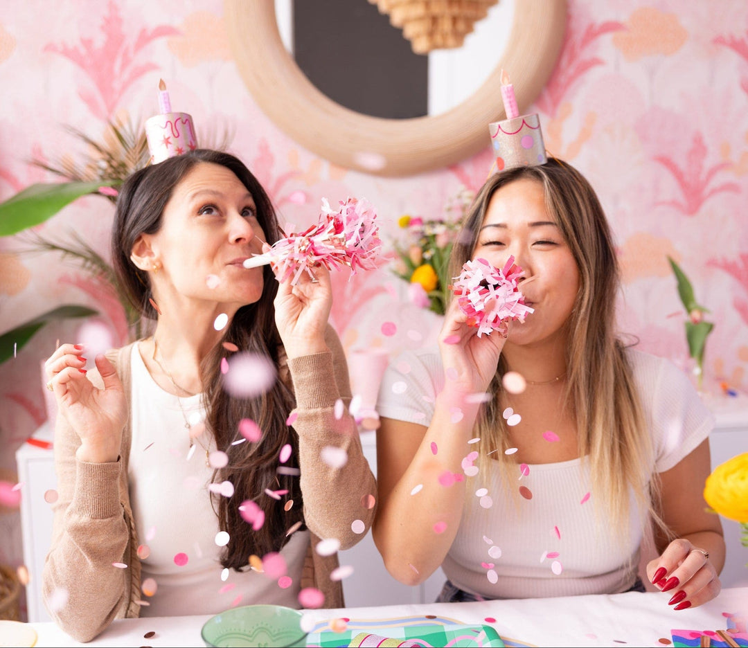 Party horn in pink with multicolor confetti for birthdays and bachelorettes