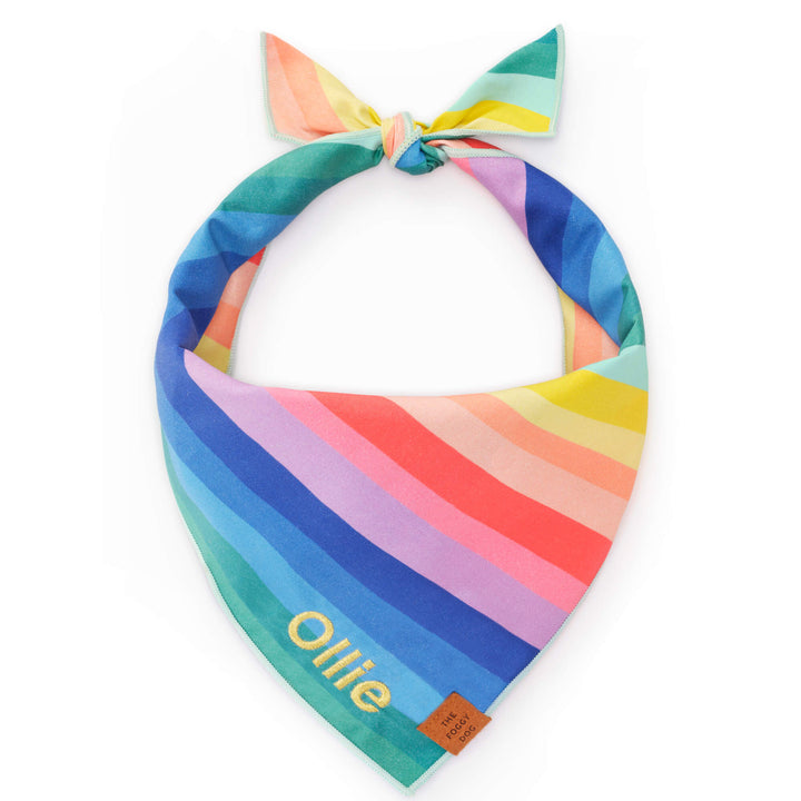 Colorful striped bandana with 'Ollie' branding on a white background