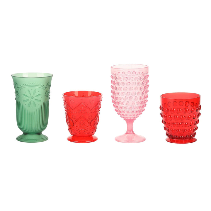 Four holiday vintage-style plastic cups in green, red, and pink on a white background