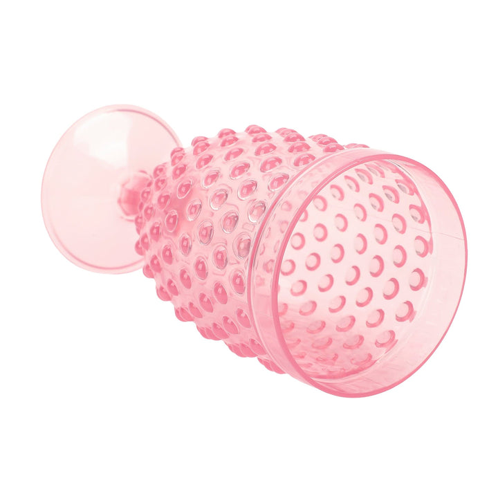 Pink hobnail goblet lying on its side