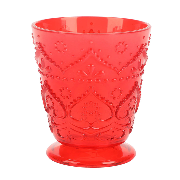 Red pressed-pattern plastic tumbler with a footed base and scroll details