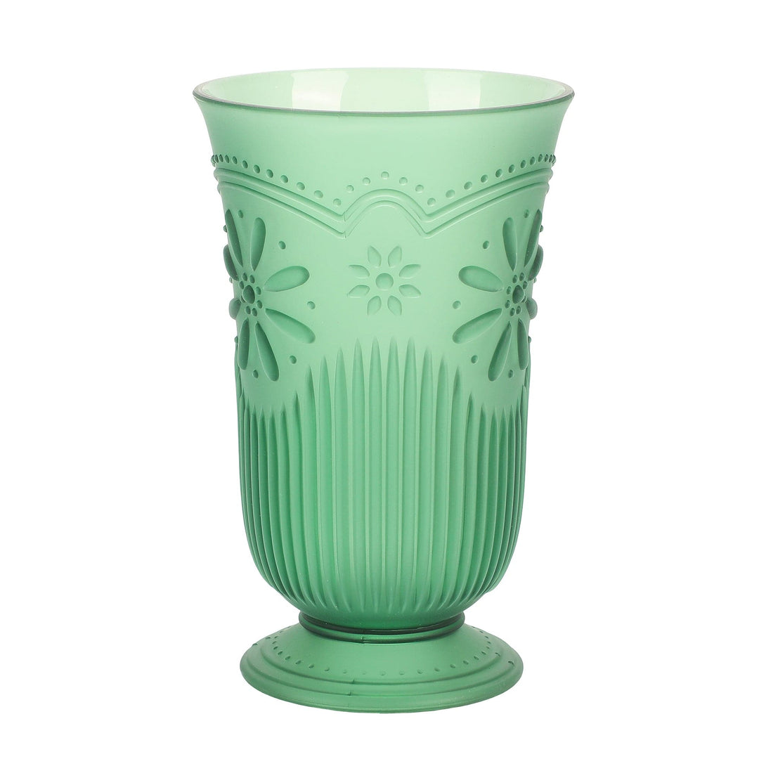 Tall green plastic cup with a footed base and pressed daisy pattern