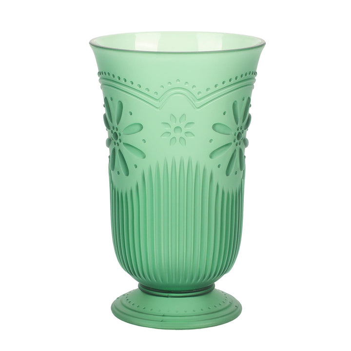 Tall green plastic cup with a footed base and pressed daisy pattern
