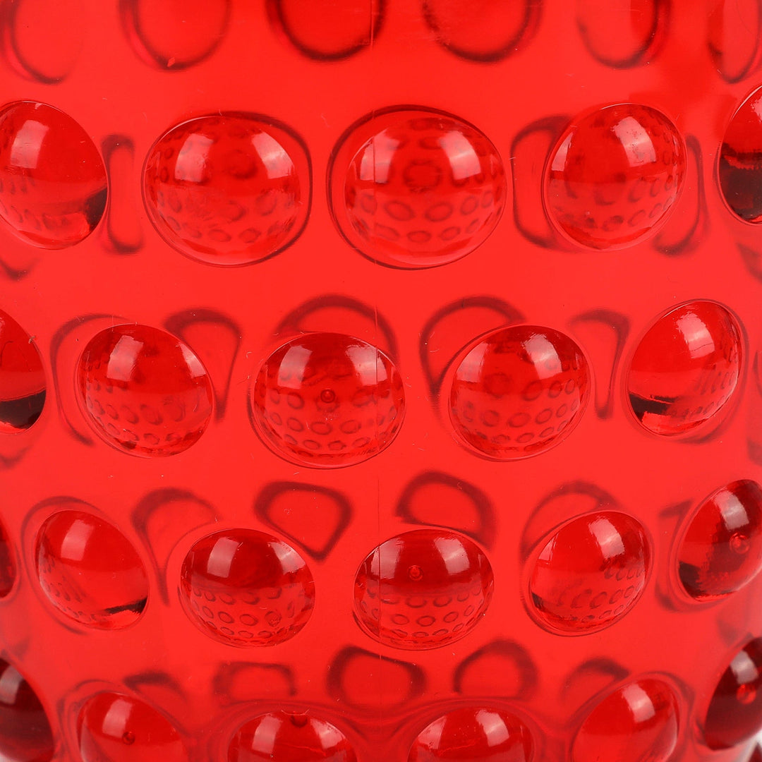 Close-up of the raised hobnail dots on the red tumbler
