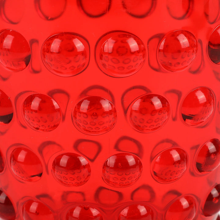 Close-up of the raised hobnail dots on the red tumbler