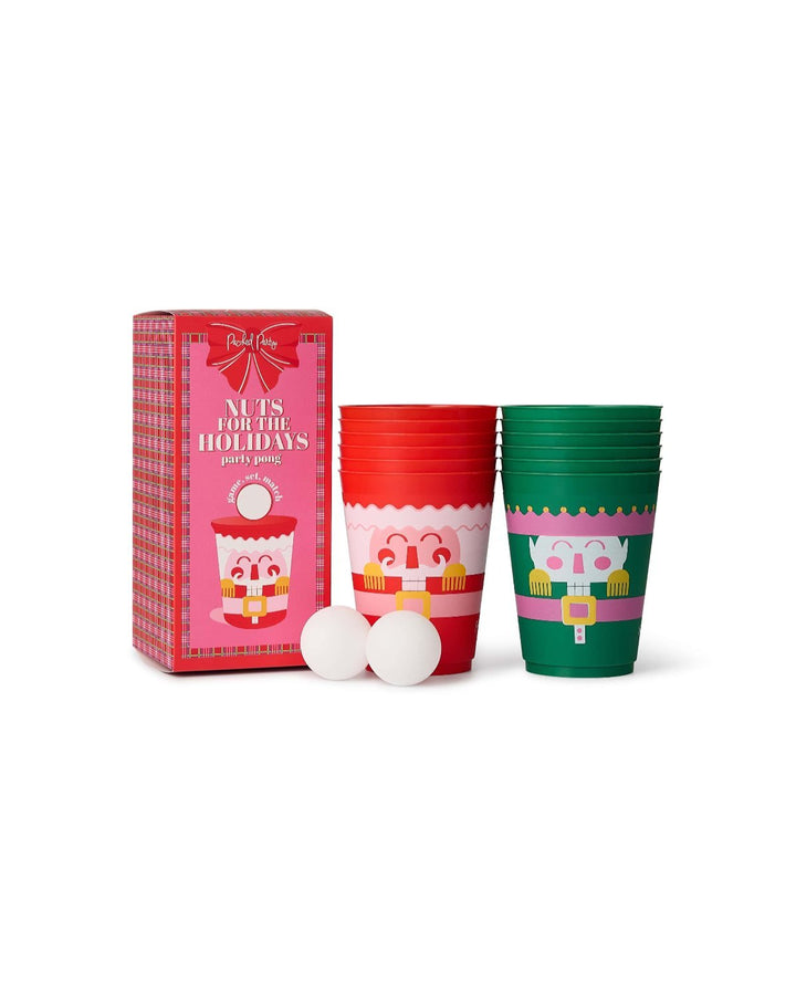 Red and green nutcracker pong cups with ping pong balls, a ready-to-play Christmas game for adults