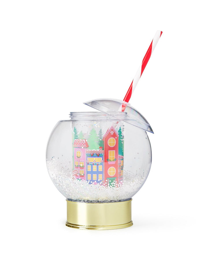 Snow globe cup with its dome lid tilted open and the striped straw through the top