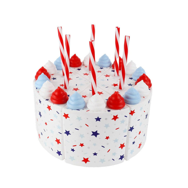 Six red, white, and blue cake slice cups with frosting swirls and striped straws on white