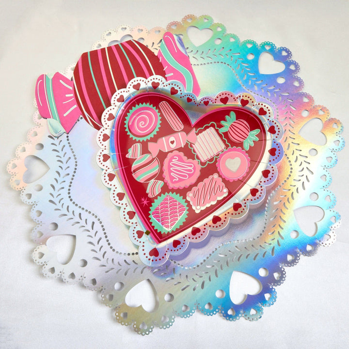 Silver foiled doily placemats, 15 inches round with heart shaped cutouts